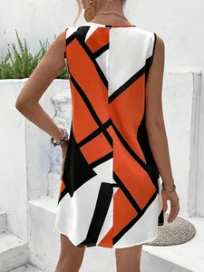 Stylish back view of a sleeveless mini dress with bold orange and black geometric prints