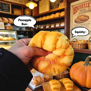 Close-up detail of a squishy faux bread toy being squeezed in a warm bakery setting