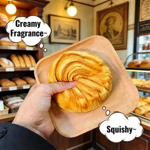 Detail view of a realistic bread squishy being squeezed on a wooden plate in a bakery