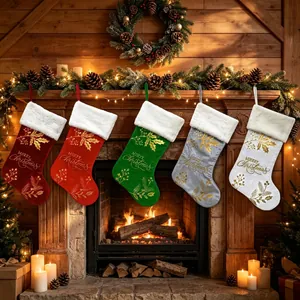 Set of colorful velvet Christmas stockings hanging on a festive fireplace mantle