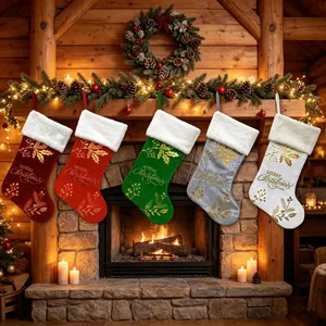 Set of 5 luxury velvet Christmas stockings with gold embroidery hanging on fireplace mantel.