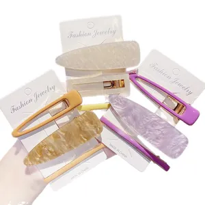 Trendy 3-piece acrylic marble hair clip set for women in elegant cream and purple tones