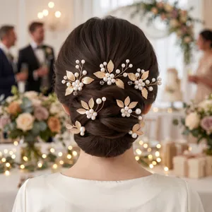 Elegant gold leaf and pearl hair pin set for wedding hairstyle in formal setting.
