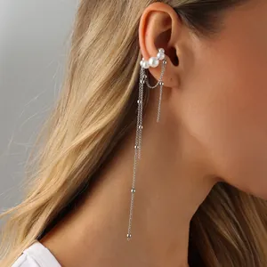 Elegant long tassel ear cuff with pearls shown on model providing a sophisticated look
