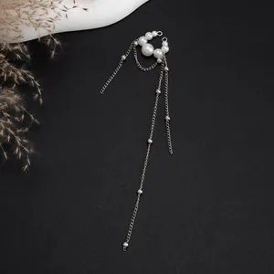 Elegant long silver chain tassel ear cuff featuring white pearls in a delicate style