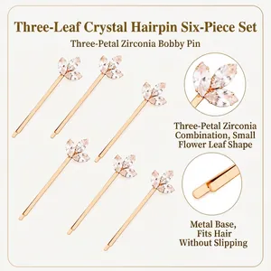 Detailed view of six-piece gold-tone hairpin set featuring crystal leaf design.