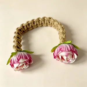 Handmade bohemian braided hemp rope curtain tieback featuring two pink silk roses detail