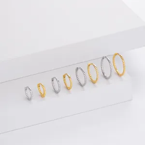 Detail view of twisted rope hoop earrings in silver and gold sterling silver S925 finish