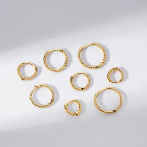 Macro view of gold twisted rope hoop earrings in various sizes, S925 sterling silver