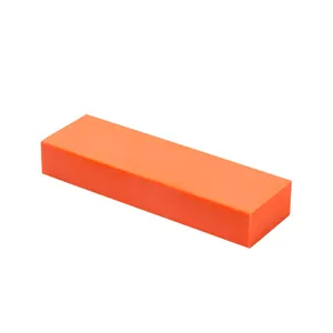 Macro view of a durable orange rubber block for bathroom limescale and rust removal