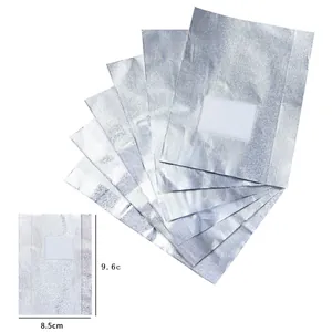 Close-up detail of nail polish remover foil wraps with cotton pads, sized 8.5x9.6cm