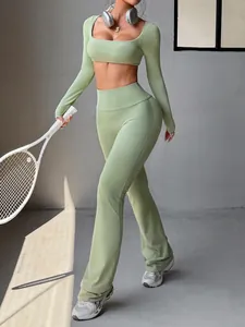 Close-up of Y2K style green long sleeve cropped top and flared yoga leggings set
