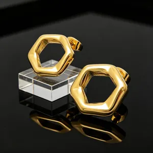 Close-up view of elegant 18K gold-plated hexagonal hollow earrings in stainless steel