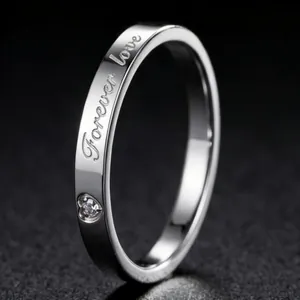 Minimalist silver stainless steel ring with Forever love engraving and heart detail