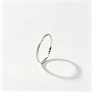 Close-up of elegant frosted titanium steel band ring with silver starry sky texture.