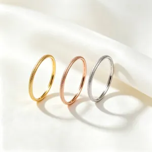 Macro view of frosted titanium steel rings with star sand texture in three colors