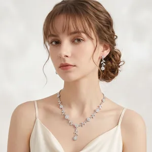 Elegant vine and flower bridal jewelry set worn by a model in a close-up detail shot