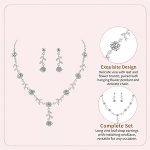 Close-up detail of silver vine and flower necklace and earrings set with rhinestones