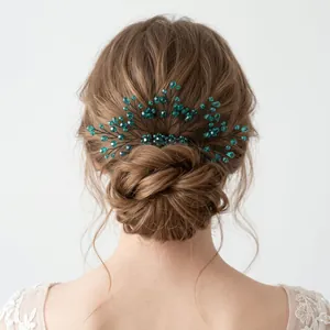 Elegant emerald green crystal hair comb for wedding bridal hairstyle detail.