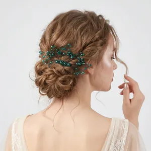 Handmade emerald green crystal wire-wrapped leaf hair comb for elegant bridal updos