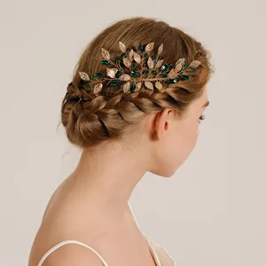 Elegant vintage gold leaf hair comb with emerald green crystals for bridal hairstyles