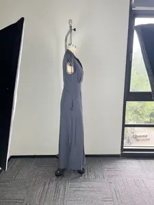 Side view of an elegant grey sleeveless maxi dress with a sophisticated notched collar detail