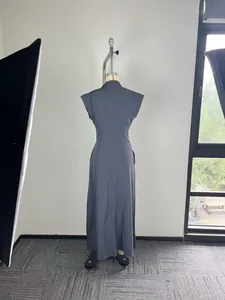 Back view of elegant charcoal grey maxi dress with stand collar and cap sleeves.
