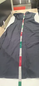 Detail shot showing length of short sleeve dark grey maxi dress with measuring tape