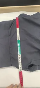 Physical measurement photo showing the length of an elegant grey summer dress with sleeves