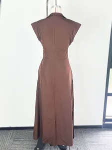 Back view detail of elegant brown maxi dress with stand-up collar and cap sleeves