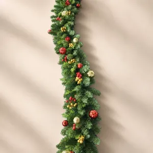 2.7m Christmas garland with artificial pine branches, red berries and festive baubles