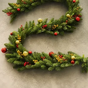Lush 2.7m artificial Christmas garland decorated with red berries and gold ornaments