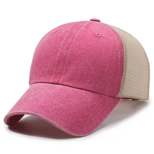 Close-up detail showing the washed pink cotton fabric and breathable beige mesh back.