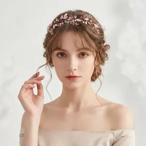 Handgefertigtes Haarband mit rosa Kristallen für elegante Brautfrisuren.