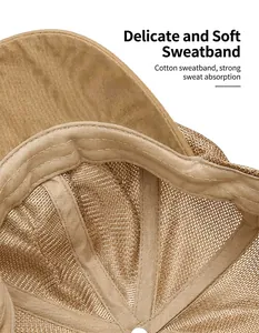 Detail shot of cotton sweatband and mesh interior on beige summer newsboy hat.