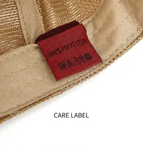 Close-up detail of summer mesh beret hat showing a 100% polyester care label and texture