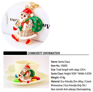 Christmas Santa Claus keychain with sparkling rhinestones and green enamel gift bag