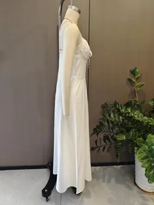Full side view detail of elegant white A-line midi dress with delicate tie strings