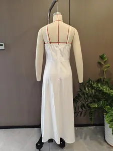 Back view of a white summer spaghetti strap A-line dress with elastic back detail