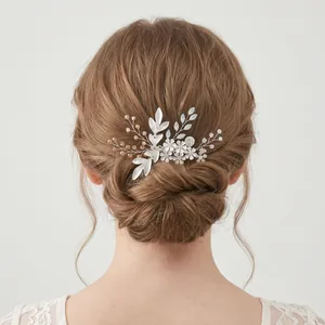 Elegant bridal hair comb with silver flowers, leaves and rhinestones for wedding updo hair