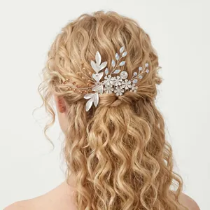 Silver wedding hair comb with crystals and flowers on blonde curly hair