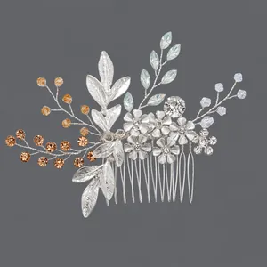 Elegant silver floral and leaf bridal hair comb with sparkling rhinestones for wedding.
