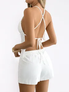 Close-up back view of white Y2K backless crochet halter top with matching shorts set.