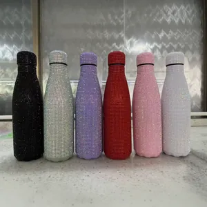 Glittering rhinestone-encrusted stainless steel insulated water bottles in multiple colors.