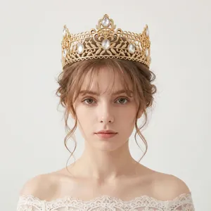 Detailed view of a luxury gold tiara with clear rhinestones for a wedding or pageant