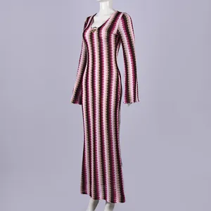 Detailed view of long sleeve slim fit maxi dress featuring a pink and burgundy zigzag knit