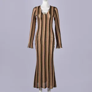 Detailed front view of long-sleeve maxi dress with colorful zig-zag knit pattern