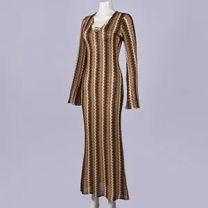 Detailed view of a slim V-neck long-sleeve maxi dress featuring a vibrant zigzag knit pattern.