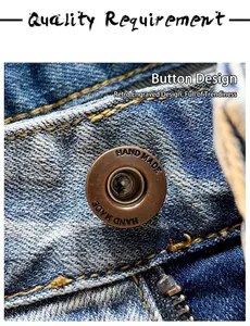 Macro shot of a vintage engraved metal button on high-quality distressed blue denim