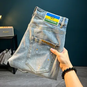 High street light blue hand-painted denim shorts with paint splatters and distressed details